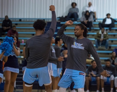 All-American Tunde Scrivner hypes up his teammates during player introductions before a game against Howard Community College on December 4th inside Novak Field House.